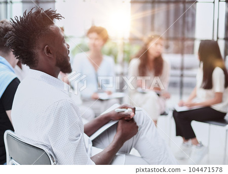 Group of Multi Ethnic Corporate People Interacting with the Speaker Group of Multi Ethnic Corporate People Interacting with the Speaker 104471578
