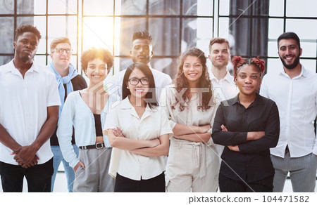 Business team formed of young businessmen standing Business team formed of young businessmen standing 104471582