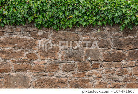 Old stone wall to be used as a background or texture. Ancient wall from old city. Old stone wall to be used as a background or texture. Ancient wall from old city. 104471605