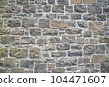 Old stone wall to be used as a background or texture. Ancient wall from old city. 104471607