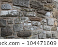 Old stone wall to be used as a background or texture. Ancient wall from old city. 104471609