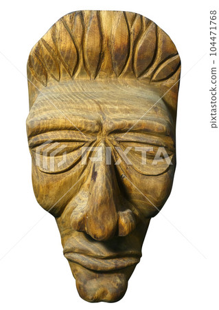 Mask of human face is carved out of wood. Antique religious totem of natives or people of ancient Mask of human face is carved out of wood. Antique religious totem of natives or people of ancient 104471768