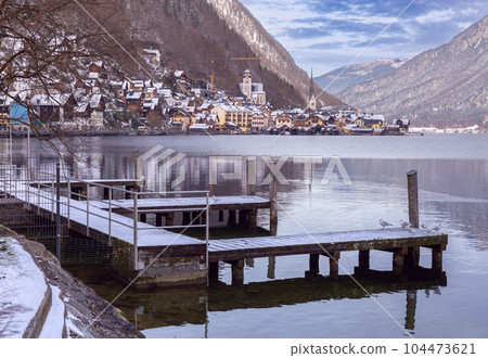 Hallstatt. Scenic view of the city and the lake at sunset. 104473621