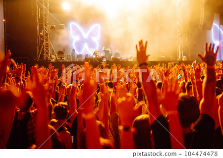 ?rowd with raised hands at music festival. Youth, party, vacation concept. 104474478