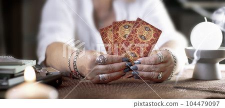 Concept of psychic advisor or ways of divination with cards. Concept of psychic advisor or ways of divination with cards. 104479097