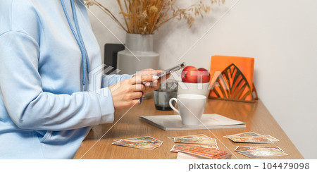 Woman makes a forecast of Tarot cards, Fortune telling esoteric predictions Woman makes a forecast of Tarot cards, Fortune telling esoteric predictions 104479098