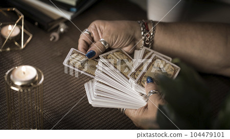 Concept of psychic advisor or ways of divination with cards. 104479101