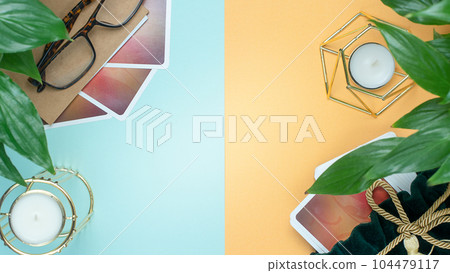 Concept of divination, magic and esotericism. Cards candle on cartomancy table. Concept of divination, magic and esotericism. Cards candle on cartomancy table. 104479117