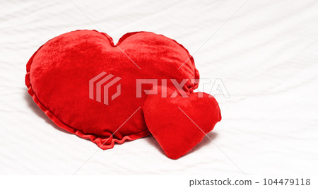 Two Red hearts shaped pillow on bed in bedroom. Valentine's day couple concept. 104479118