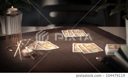 Concept of psychic advisor or ways of divination with cards. Concept of psychic advisor or ways of divination with cards. 104479119