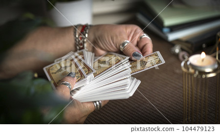 Concept of psychic advisor or ways of divination with cards. 104479123