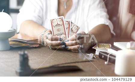 Concept of psychic advisor or ways of divination with cards. 104479129