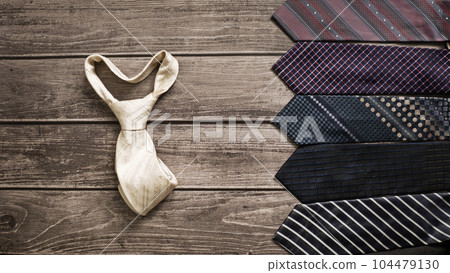 Men's necktie on Brown wooden background. Boss day, valentine's day 104479130