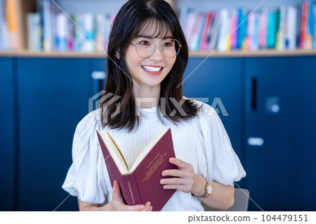 Middle-aged woman reading Middle-aged woman reading 104479151