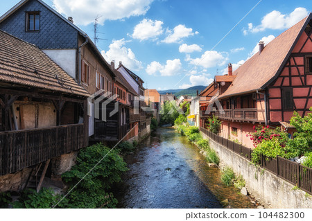 Kaysersberg half timbered houses and stream Kaysersberg half timbered houses and stream 104482300
