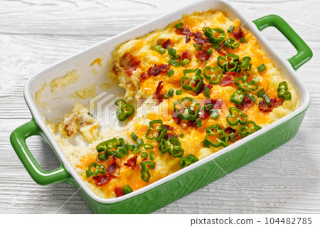Loaded smashed potatoes with cheese, bacon, cream Loaded smashed potatoes with cheese, bacon, cream 104482785
