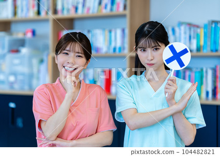 Two nurse women who put out NG plates Two nurse women who put out NG plates 104482821