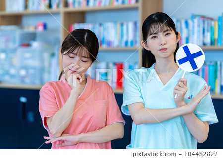 Two nurse women who put out NG plates Two nurse women who put out NG plates 104482822