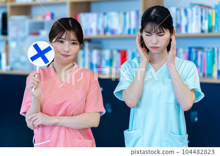 Two nurse women who put out NG plates Two nurse women who put out NG plates 104482823