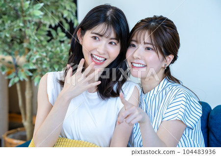 two women cheering two women cheering 104483936