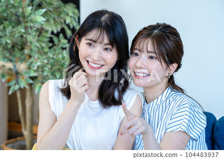 two women cheering two women cheering 104483937