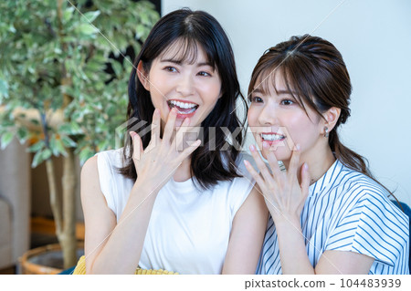 two women cheering two women cheering 104483939