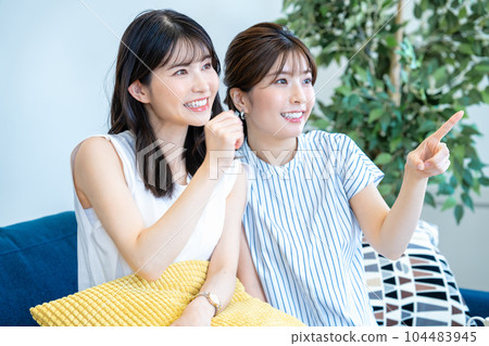 two women cheering two women cheering 104483945