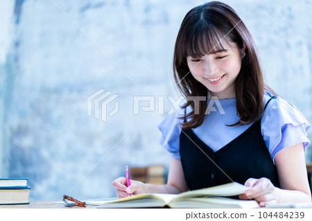 A young woman studying A young woman studying 104484239