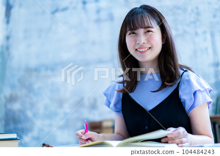A young woman studying A young woman studying 104484243