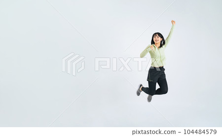 Woman in sportswear jumping Woman in sportswear jumping 104484579