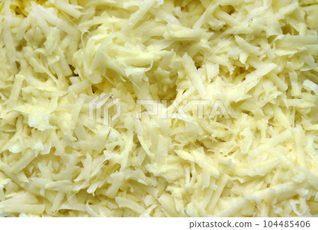 Fresh chopped potatoes. Potatoes cut into strips. Fresh vegetables. 104485406