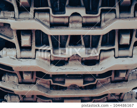Ultra close-up of the caterpillar track of stationary war tank in an undisclosed location Ultra close-up of the caterpillar track of stationary war tank in an undisclosed location 104486167