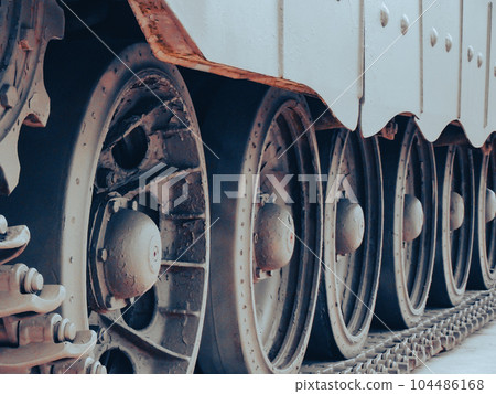 Ultra close-up of the caterpillar track of stationary war tank in an undisclosed location Ultra close-up of the caterpillar track of stationary war tank in an undisclosed location 104486168
