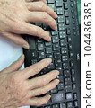 A senior studying a computer. keyboard and old man's hands 104486385