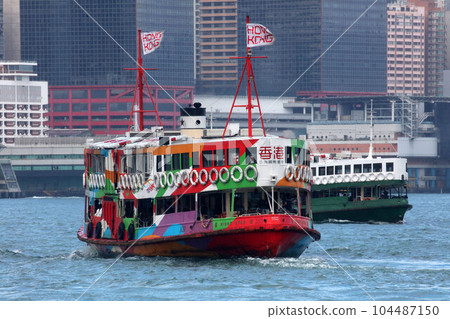 Star Ferry is a sightseeing boat that cruises around Victoria Bay with the skyscrapers of Hong Kong Island in the background. Popular with tourists. Star Ferry is a sightseeing boat that cruises around Victoria Bay with the skyscrapers of Hong Kong Island in the background. Popular with tourists. 104487150
