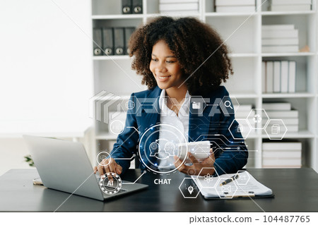 African Woman using chat bot in smartphone intelligence Ai. Chat with AI Artificial Intelligence, developed by OpenAI generate. robot in online system. in office. African Woman using chat bot in smartphone intelligence Ai. Chat with AI Artificial Intelligence, developed by OpenAI generate. robot in online system. in office. 104487765