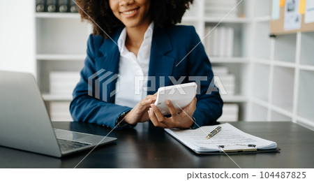 Real estate broker agent presenting and consult to customer to decision making sign insurance form agreement, home model, concerning mortgage loan offer 104487825