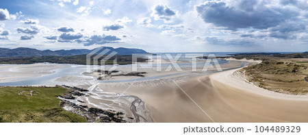 Sheskinmore bay between Ardara and Portnoo in Donegal - Ireland. Sheskinmore bay between Ardara and Portnoo in Donegal - Ireland. 104489329