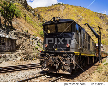 Traditional Devil's Nose train running on beautiful andean landscape, Alausi, Ecuador 104490952