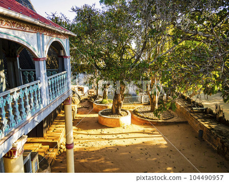 Stunning view of Fandriampahalemana palace and its beautiful courtyard with sacred fig trees, Ambohimanga, Madagascar 104490957