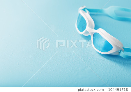 White swimming glasses with a blue lens White swimming glasses with a blue lens 104491718