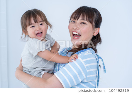 Girl kindergartener and nursery teacher 104492819