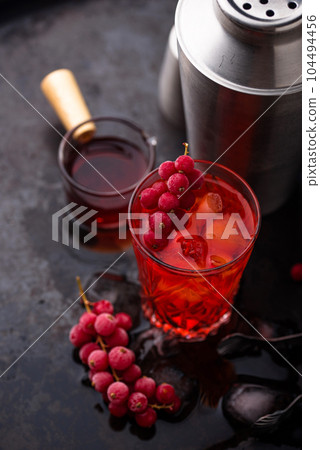Alcoholic cocktail with red currant Alcoholic cocktail with red currant 104494456