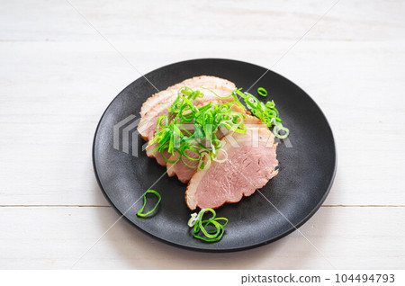Duck pastrami topped with green onions Duck pastrami topped with green onions 104494793