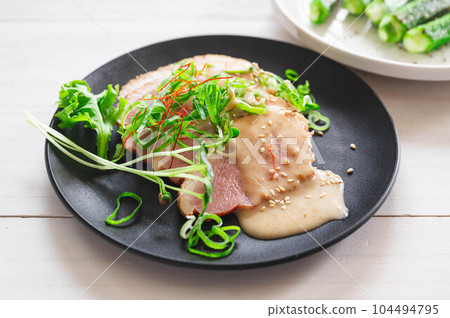 Duck pastrami with sesame dressing Duck pastrami with sesame dressing 104494795