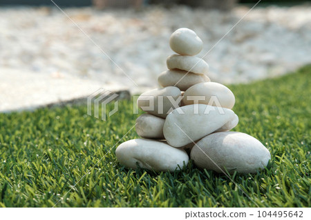 Stack of white pebble stones 104495642