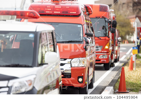 Incident, police car and fire engine at the scene of the accident 104495904