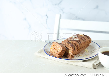 Concept of delicious sweet food - cake roll Concept of delicious sweet food - cake roll 104497928