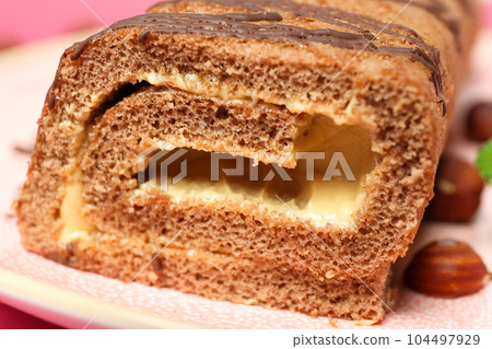Concept of delicious sweet food - cake roll Concept of delicious sweet food - cake roll 104497929