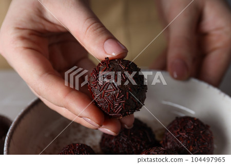 Traditional brazilian sweet - Brigadeiro, brazilian Chocolate candy Traditional brazilian sweet - Brigadeiro, brazilian Chocolate candy 104497965